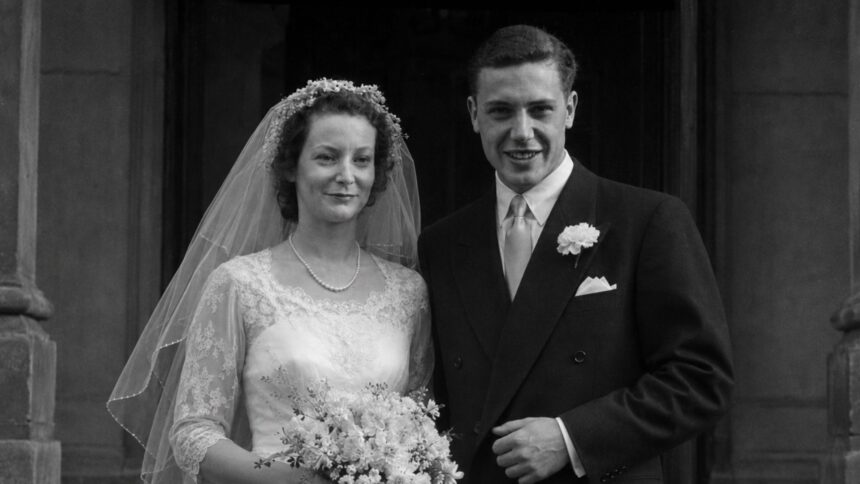 Black and white wedding photo of Jane Ebsworth Oriel and David Attenborough on their wedding day in 1950