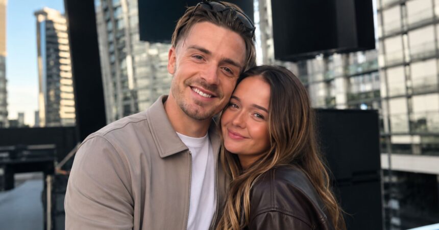 Manchester City footballer Jack Grealish smiling warmly while posing closely with his younger sister Kiera Grealish outdoors against a modern city background.