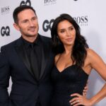 British television presenter attending a formal red-carpet event with her husband
