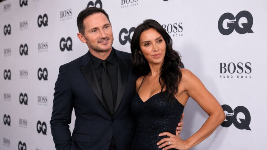 British television presenter attending a formal red-carpet event with her husband