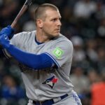 Outfielder Daulton Varsho holding a bat in his Toronto Blue Jays uniform before his trade to the Houston Astros.