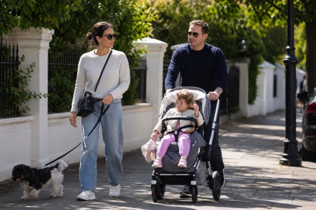 Frank Lampard walking with his family and a child in a stroller