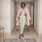 Michelle Obama wearing a pink coat, floral blouse, and mint green trousers, spring 2026
