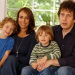 A portrait of broadcast journalist Rachel Royce and columnist Rod Liddle sitting on a sofa with their two young sons, Tyler and Wilder.