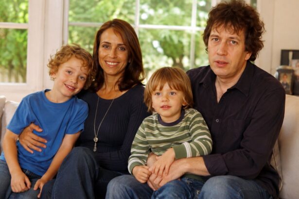 A portrait of broadcast journalist Rachel Royce and columnist Rod Liddle sitting on a sofa with their two young sons, Tyler and Wilder.