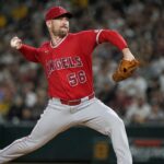 Relief pitcher Ryan Zeferjahn throwing a pitch in a red Los Angeles Angels uniform before his trade to the Chicago Cubs.